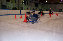 Jim rides his ice trike through the slalom.