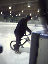 Norm on his newly crafted ice racer.  At the bottom of the sock is a single skate boot.